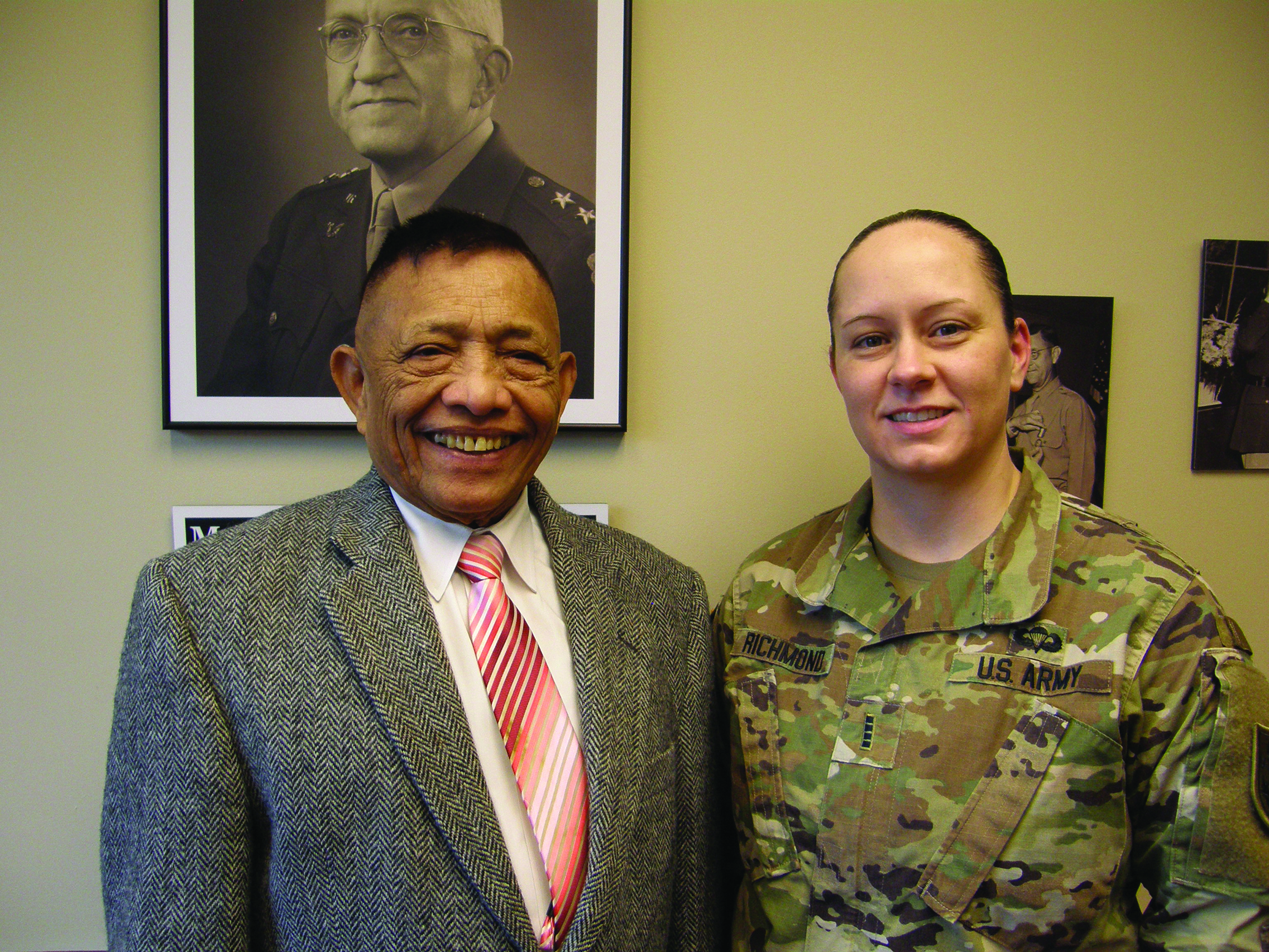 Now retired CW5 Rosauro L. Lindogan stands
        beside CW5 Tammy Richmond, Command Chief
        Warrant Officer at the Legal Center and School.
        (Courtesy: Fred Borch).